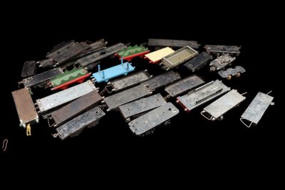 a lot of small toy trains that are on the table