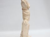 statue of a woman holding a bird in her hand