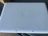 an apple laptop computer sitting on top of a table