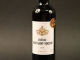 a close up of a bottle of wine on a black background