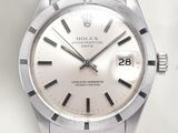 an image of a stainless steel watch with a white dial