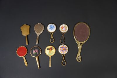 a lot of different types of hair brushes on the table