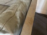 a couch that has a pillow on it in a room