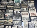 a lot of old postcards that are on the table
