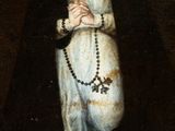 an image of a painting of a woman holding a rosary