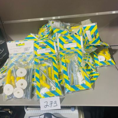 a pile of toilet paper and toilet paper rolls on a desk
