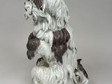 an image of a dog figurine sitting on its hind legs