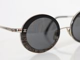 sunglasses on a white surface with a white background