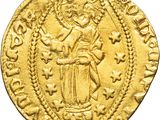 a gold coin with an image of a woman holding a child