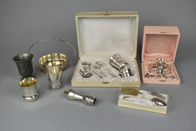 a box of silverware sitting on a table next to other items