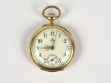 a gold pocket watch on a white surface