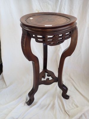a small table with a wooden top on a white background