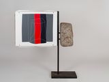 a picture of a rock with a piece of art on it