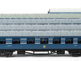 three blue trains on a white surface with one train on the other