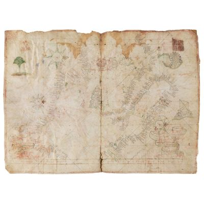 an old book with a map of the world on it
