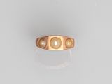 an image of a gold ring with pearls on it