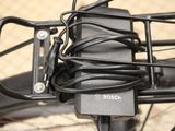 a close up view of a bicycle with wires attached to the handlebars