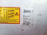 a sticker on the side of a white refrigerator