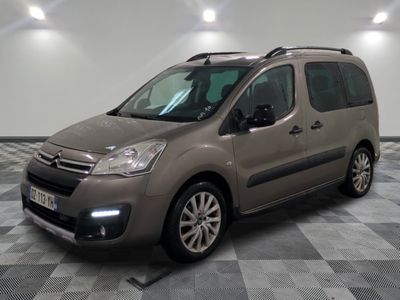 the small van is parked in a large room with a checkered floor