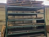 a large stack of shelves in a warehouse with lots of wood