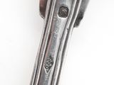 a close up of a knife on a white surface with a white background