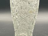 a glass vase that is sitting on a table