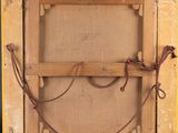 an old picture of a wooden frame with a rope around it