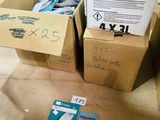 two boxes that are sitting on the floor next to each other