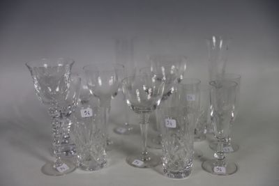 a lot of wine glasses that are sitting on a table