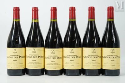 six bottles of wine are lined up on a table