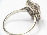 a silver ring with a diamond in it