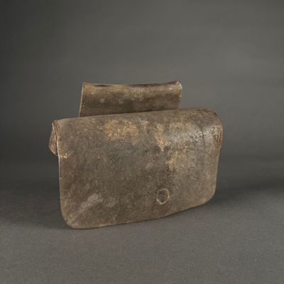 an old piece of stone sitting on top of a table