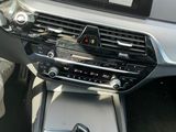 the interior of a car with a steering control and a dash board