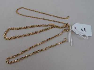 a close up of a gold chain with a tag on it