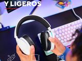 a person sitting at a desk with headphones on