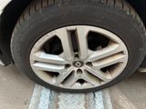 a close up of a tire on a car ' s rim