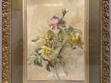 tableau représentant un bouquet de fleurs dans un cadre doré accroché au mur