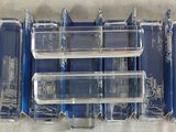 a lot of blue cases that are sitting on a table
