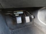 two pedals that are sitting on the floor of a car