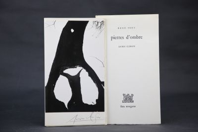 an open book with a black and white drawing of a bird on it ' s back