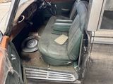 an old car that is sitting in the back of the truck