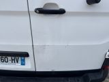 a white van parked in a parking lot with a number plate on it