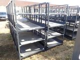 a lot of empty metal shelves in the grass