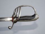 a close up of a sword with a metal handle