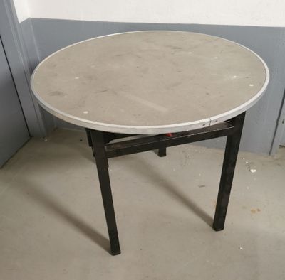 a white table with a black legs and a white table top
