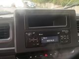 a car dashboard with a radio and a steering wheel