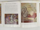 an open book with a picture of a man sitting on a chair