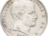 an old silver coin with a portrait of a man on it