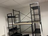 a picture of a room with a ladder and shelves