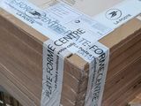 a stack of boxes sitting on top of a metal rack